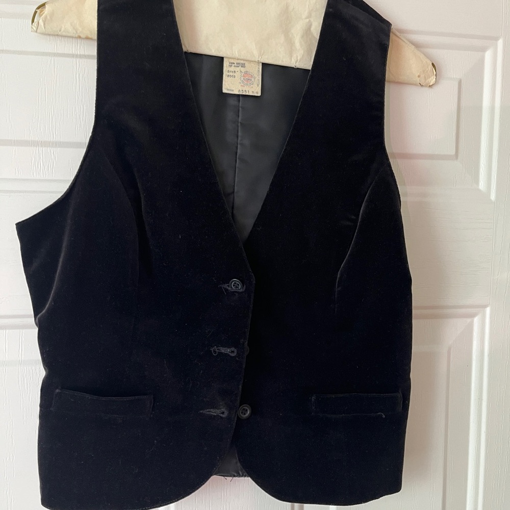 Vest, velveteen, black. No tags but is an 8 or medium. Gently used.